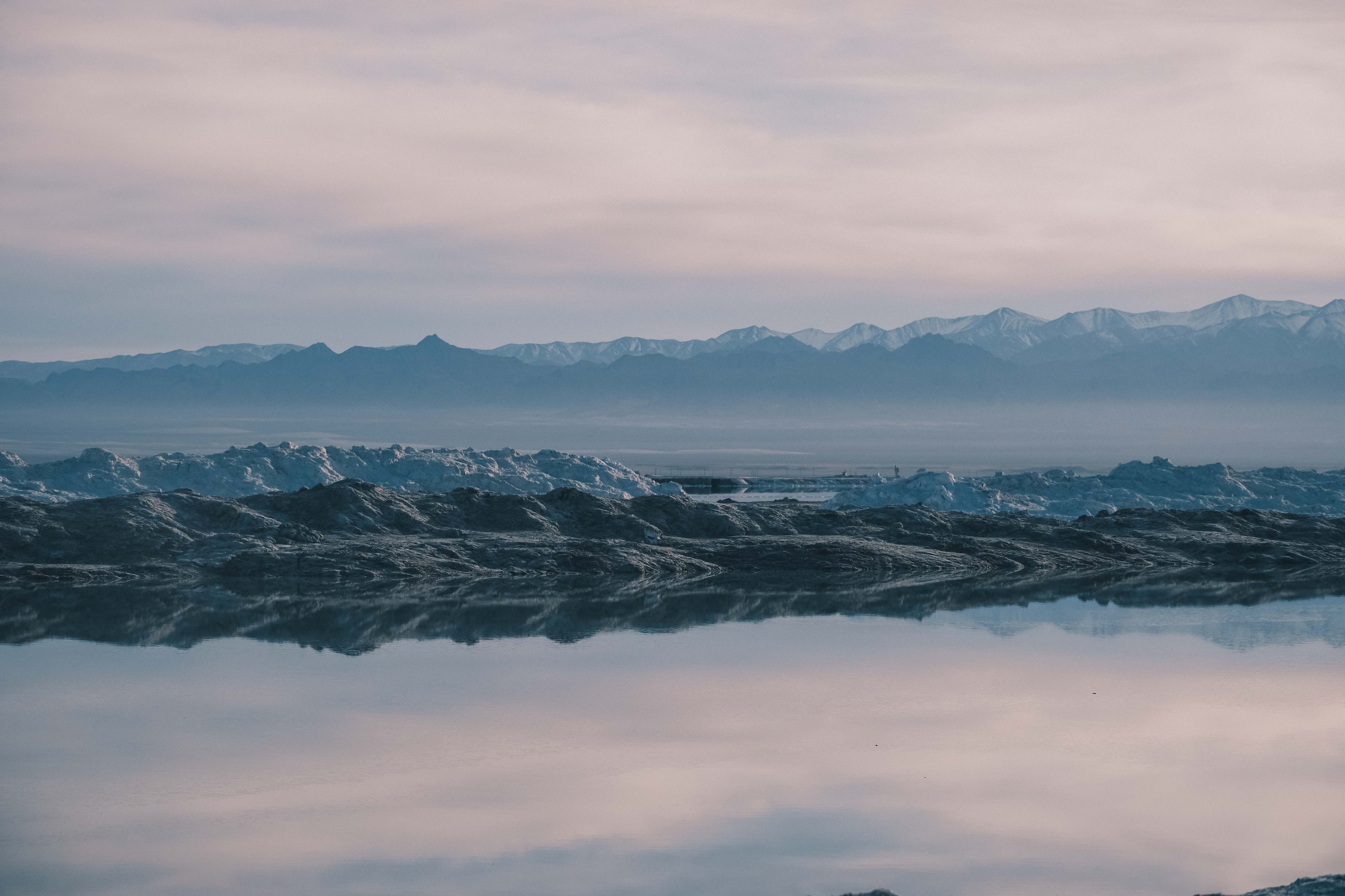 Salt ridges beside a reflective lake
