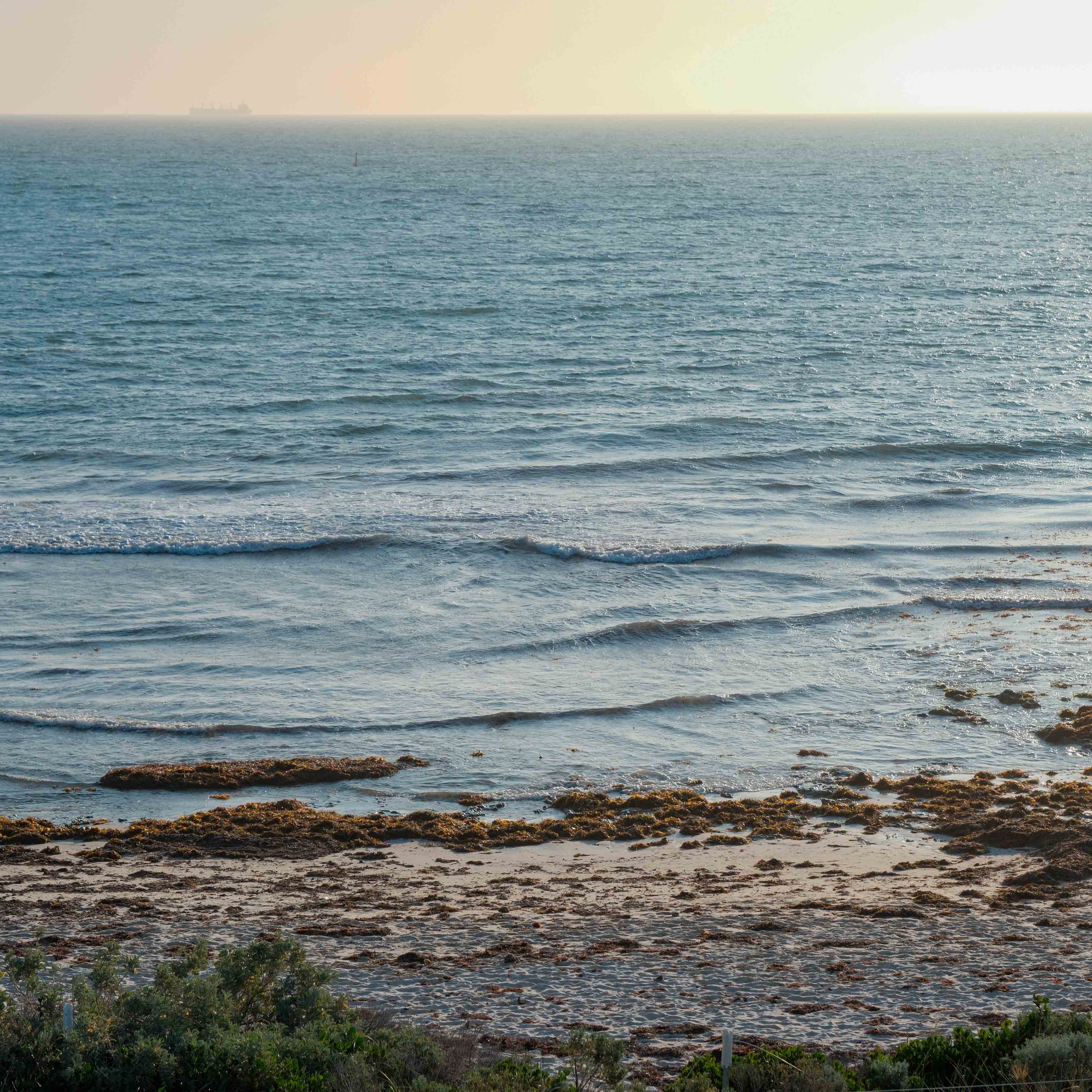 Lines of small waves approaching the beach